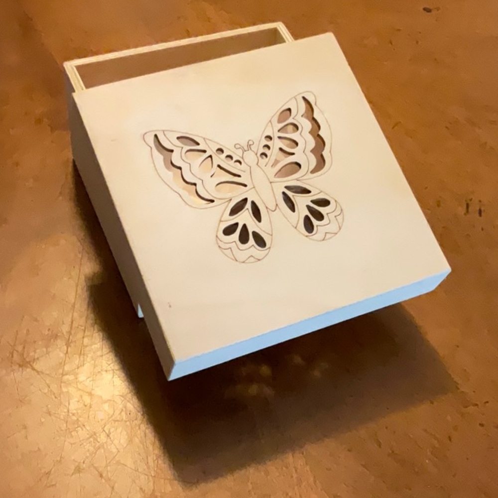 Wooden box with butterfly cut out